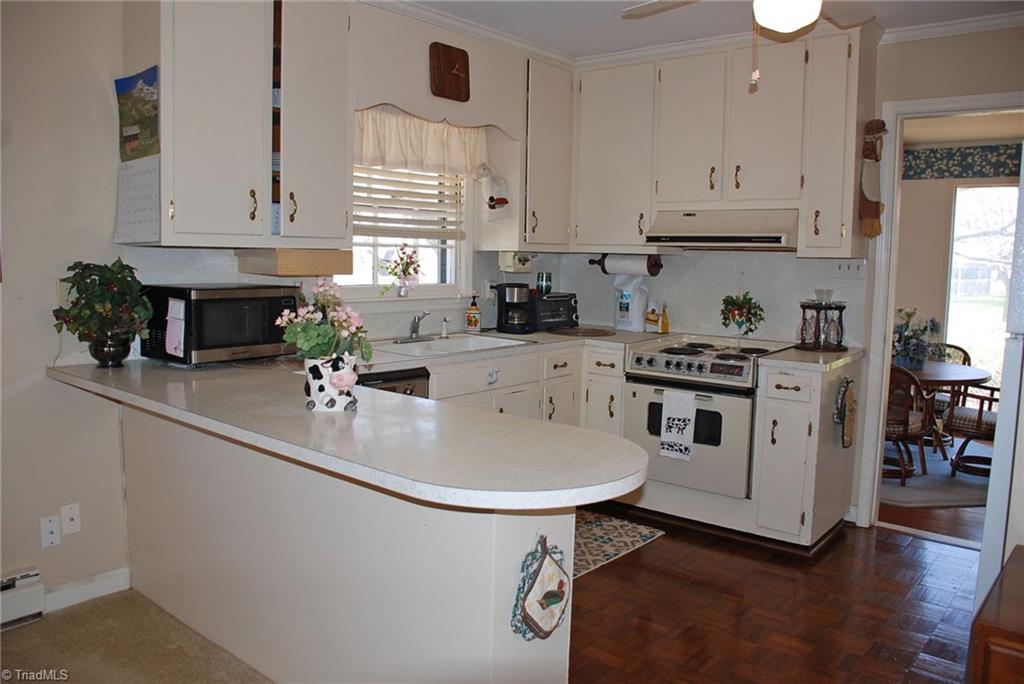 5704 Old Oak Ridge Road Greensboro, NC 27410 - Photo 6 of 22 Kitchen with view of sun room