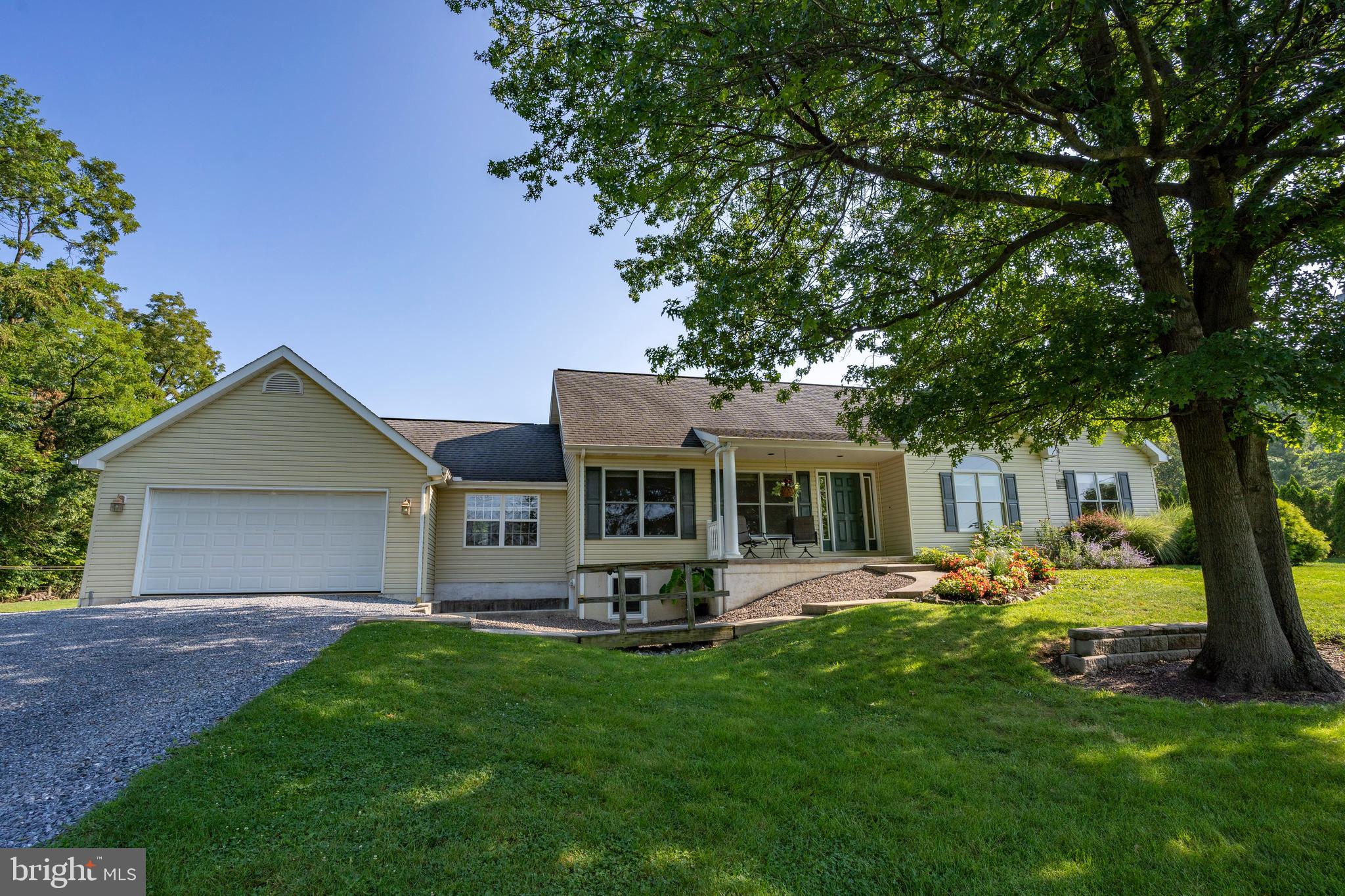 556 East Pleasantview Road Manheim, PA 17545 - Photo 11 of 93 a front view of house with a garden and patio