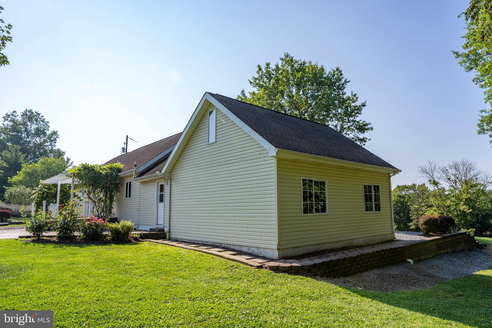 556 East Pleasantview Road Manheim, PA 17545 - Photo 24 of 93 a view of a house with backyard and sitting area