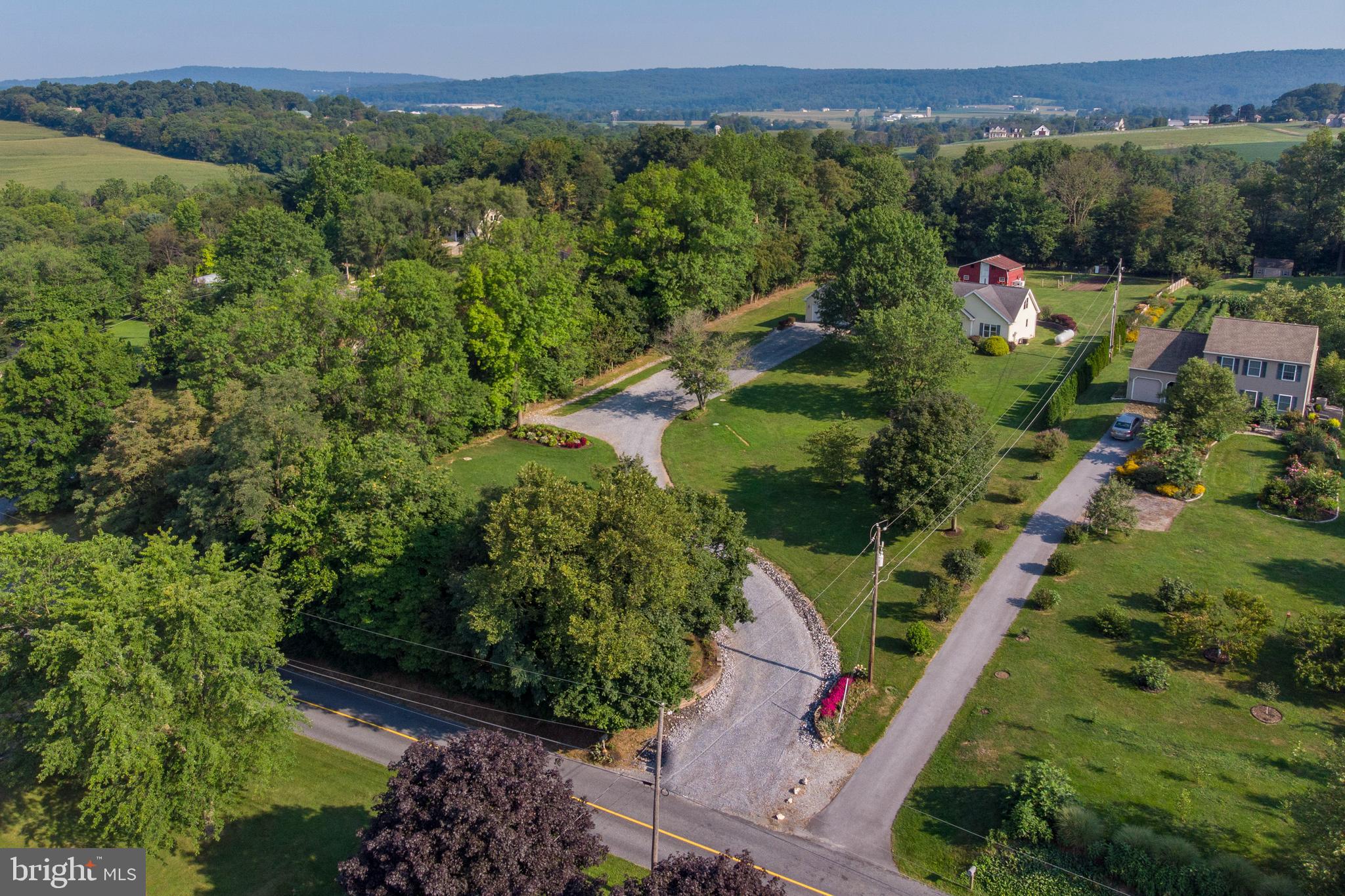 556 East Pleasantview Road Manheim, PA 17545 - Photo 4 of 93 an aerial view of residential houses with outdoor space and trees