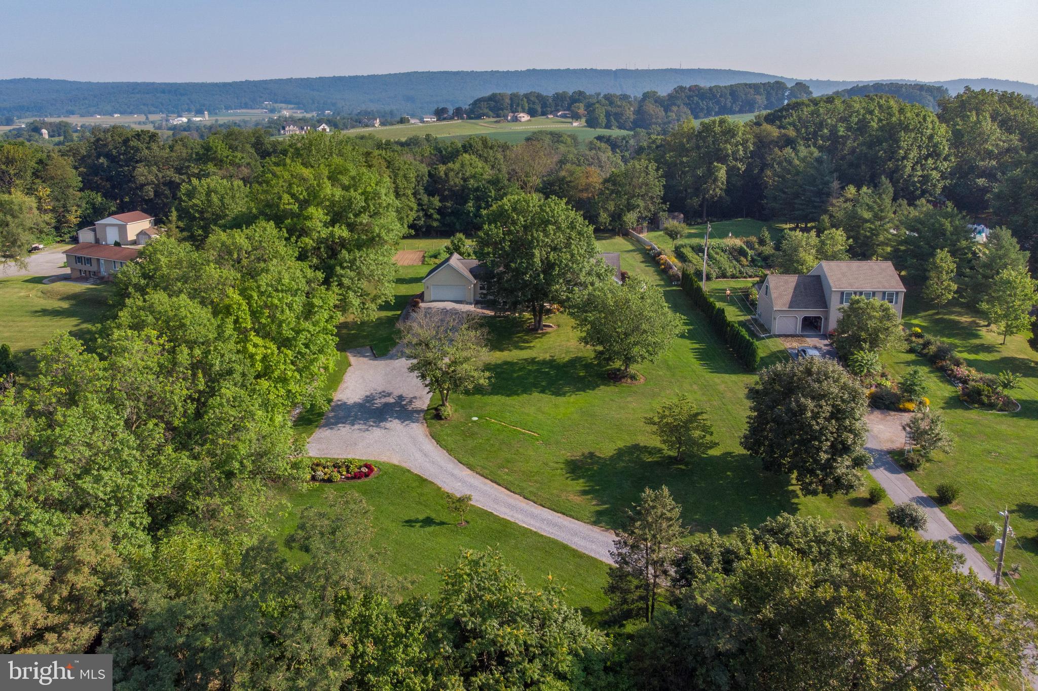 556 East Pleasantview Road Manheim, PA 17545 - Photo 5 of 93 an aerial view of a house with a yard and lake view