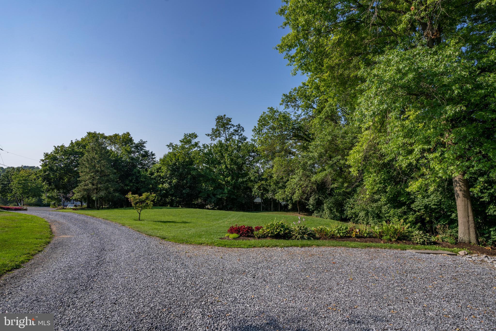 556 East Pleasantview Road Manheim, PA 17545 - Photo 44 of 93 a view of a field with plants and trees in the background