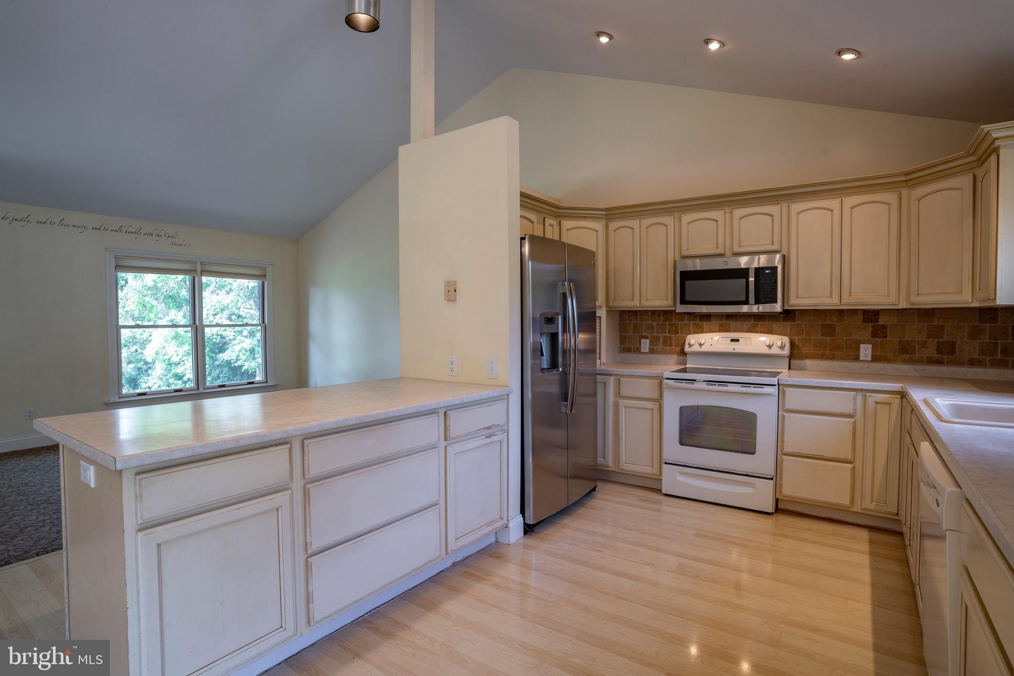 556 East Pleasantview Road Manheim, PA 17545 - Photo 54 of 93 a kitchen with kitchen island granite countertop a stove a sink and a refrigerator