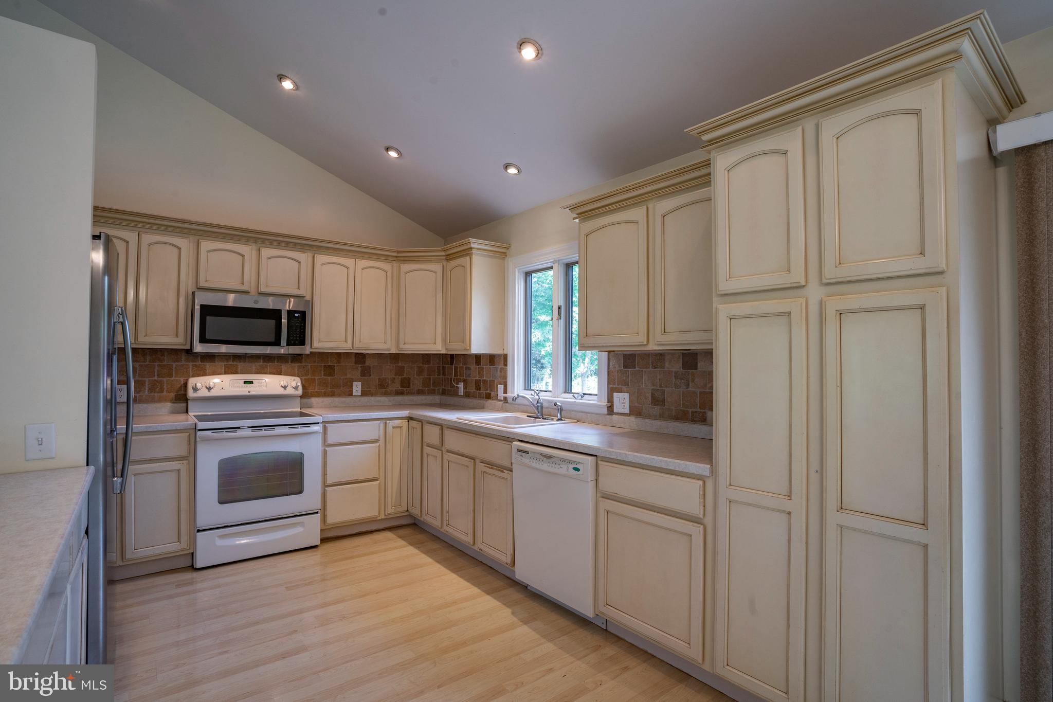 556 East Pleasantview Road Manheim, PA 17545 - Photo 55 of 93 a kitchen with white cabinets and stainless steel appliances