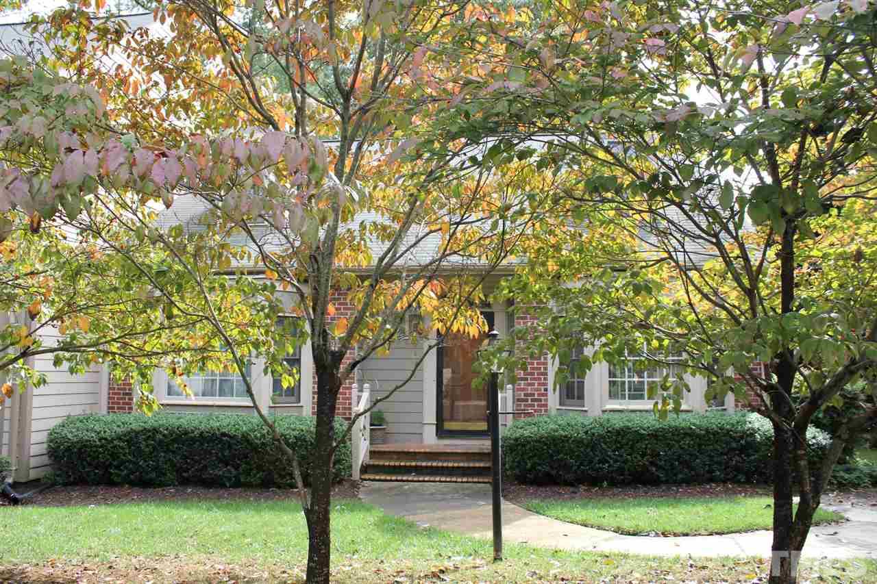 a tree in the garden of a house