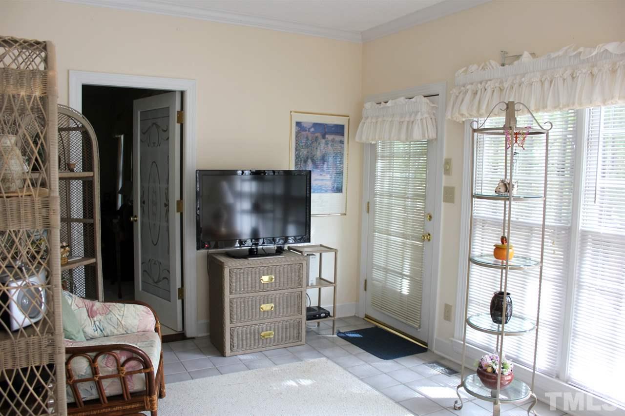 7920 Footman Way Raleigh, NC 27615 - Photo 12 of 25 a bedroom with a bed and a television