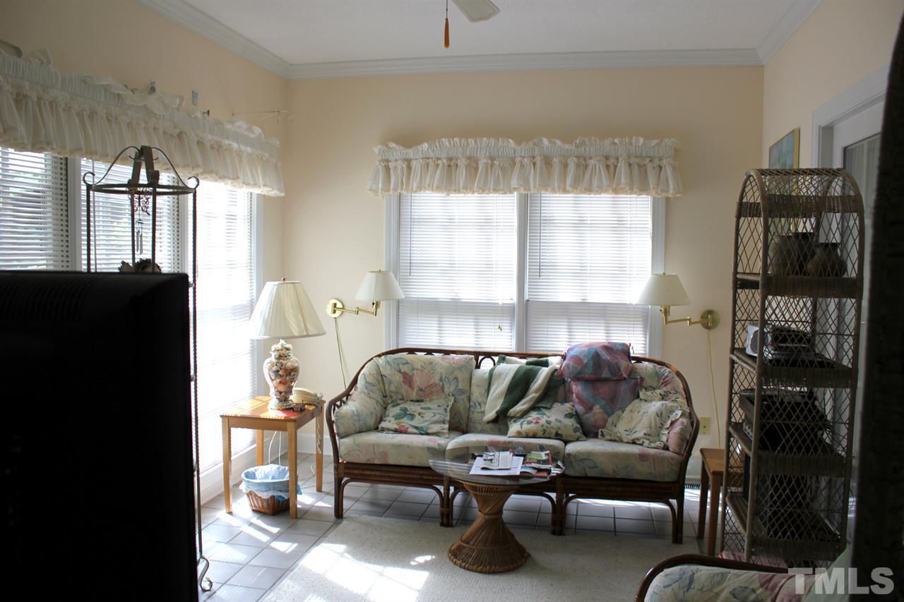 7920 Footman Way Raleigh, NC 27615 - Photo 13 of 25 a living room with furniture and a large window