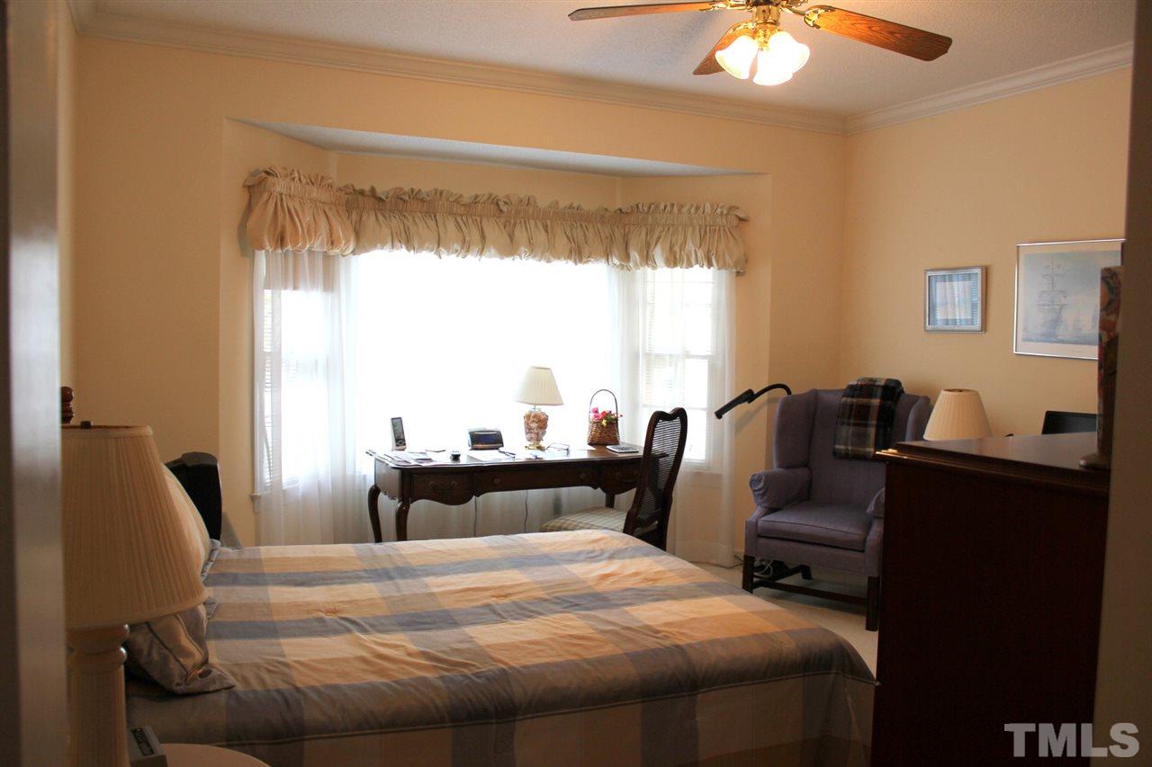 7920 Footman Way Raleigh, NC 27615 - Photo 18 of 25 a bedroom with bed and window