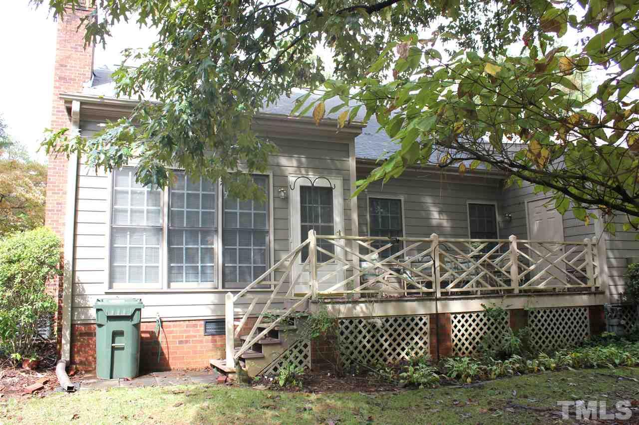 7920 Footman Way Raleigh, NC 27615 - Photo 21 of 25 a front view of a house with garden