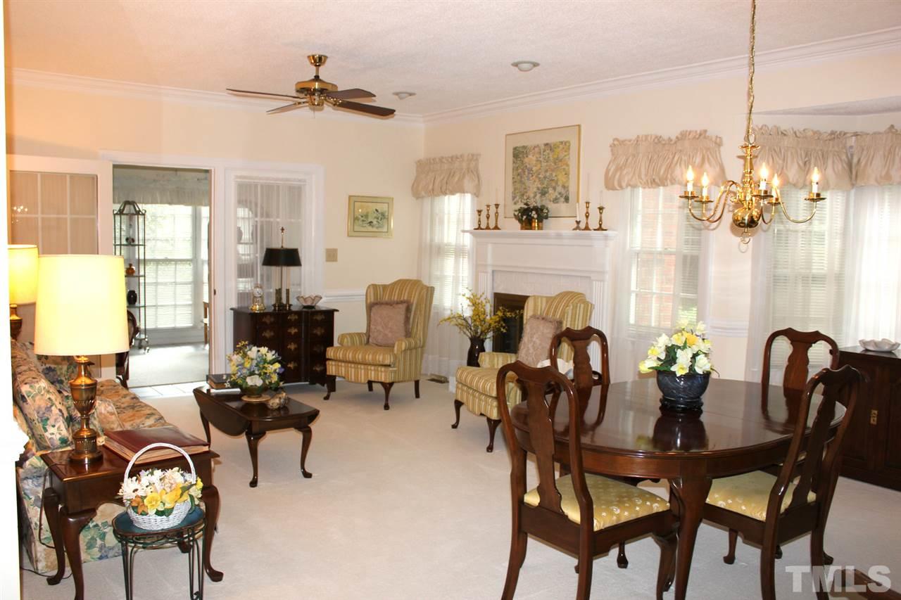 7920 Footman Way Raleigh, NC 27615 - Photo 7 of 25 a view of a dining room with furniture window and outside view