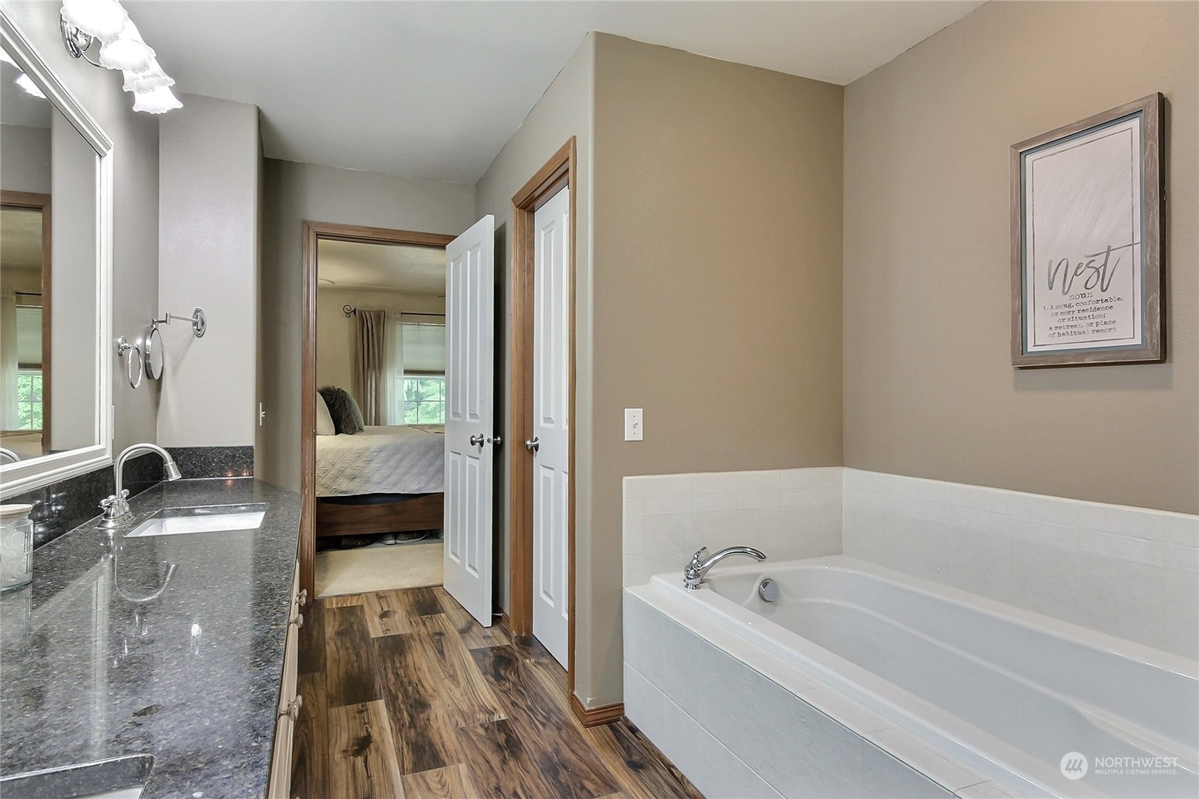 17502 Littlerock Road Southwest Rochester, WA 98579 - Photo 14 of 20 a bathroom with a tub a sink and a large mirror