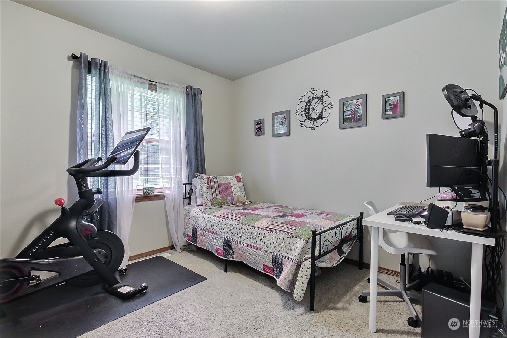 17502 Littlerock Road Southwest Rochester, WA 98579 - Photo 17 of 20 a bedroom with bed and a flat tv screen