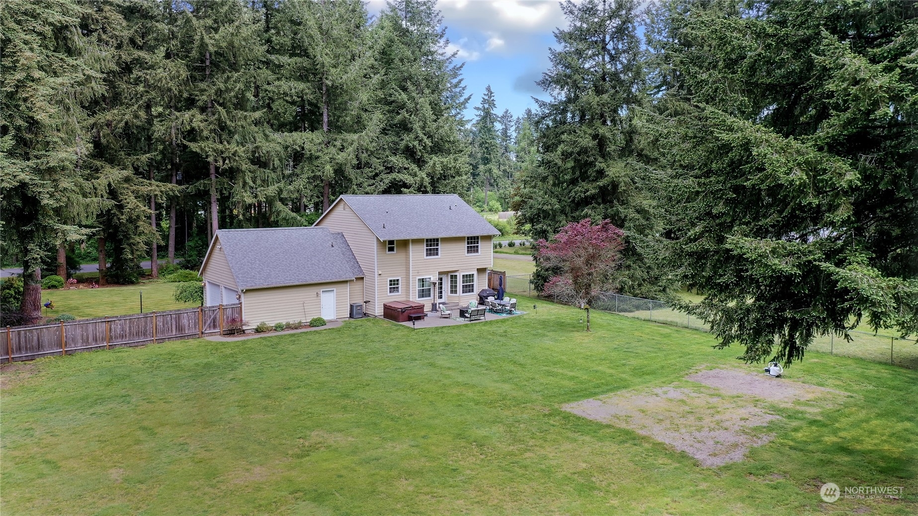 17502 Littlerock Road Southwest Rochester, WA 98579 - Photo 19 of 20 a view of a house with a yard and sitting area