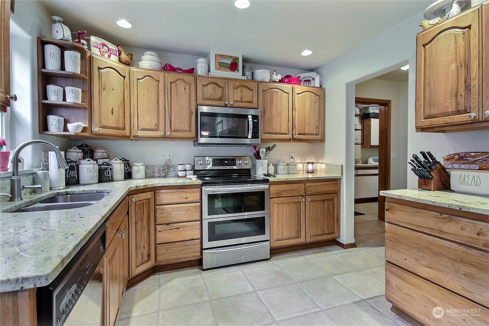 17502 Littlerock Road Southwest Rochester, WA 98579 - Photo 8 of 20 a kitchen with stainless steel appliances granite countertop a sink and cabinets