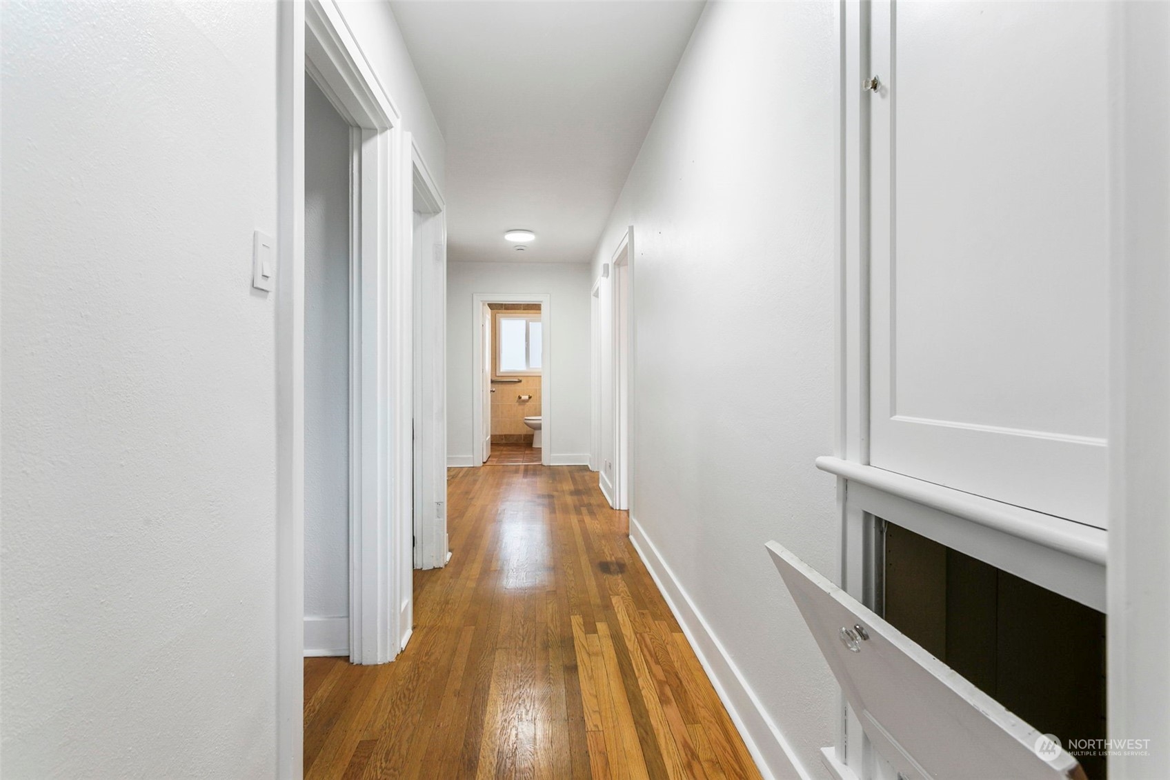 710 Prospect Avenue North Kent, WA 98031 - Photo 14 of 37 a view of a hallway with wooden floor and staircase