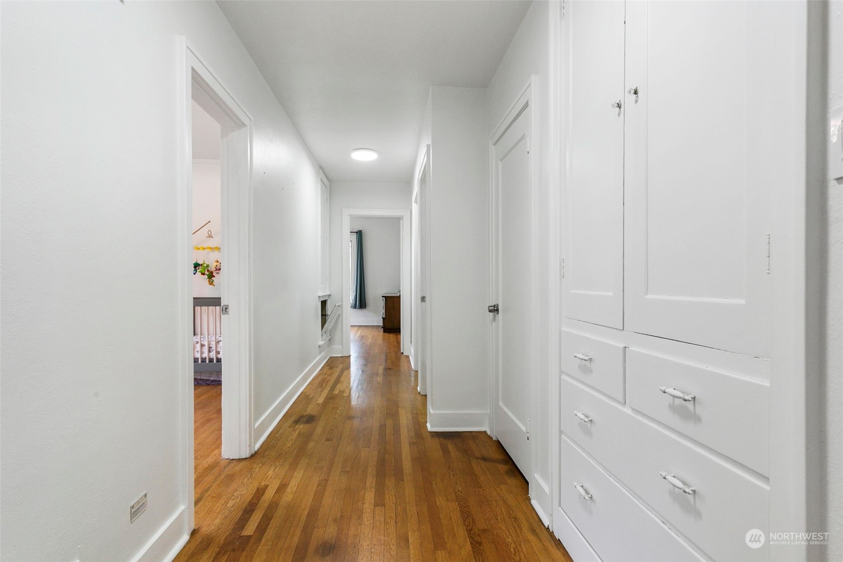 710 Prospect Avenue North Kent, WA 98031 - Photo 15 of 37 a view of a hallway with wooden floor