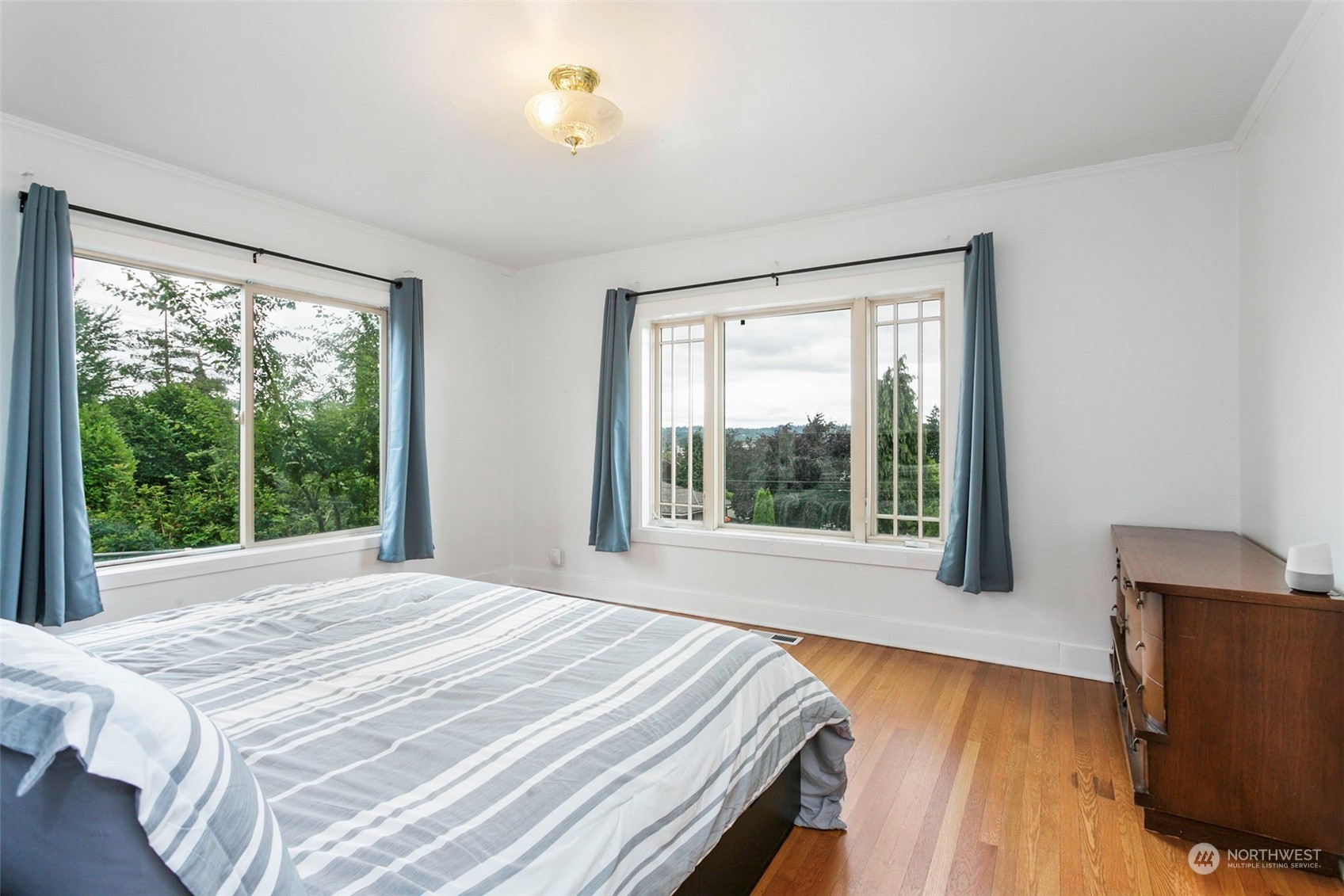 710 Prospect Avenue North Kent, WA 98031 - Photo 16 of 37 a bedroom with a bed and a large window with outer view