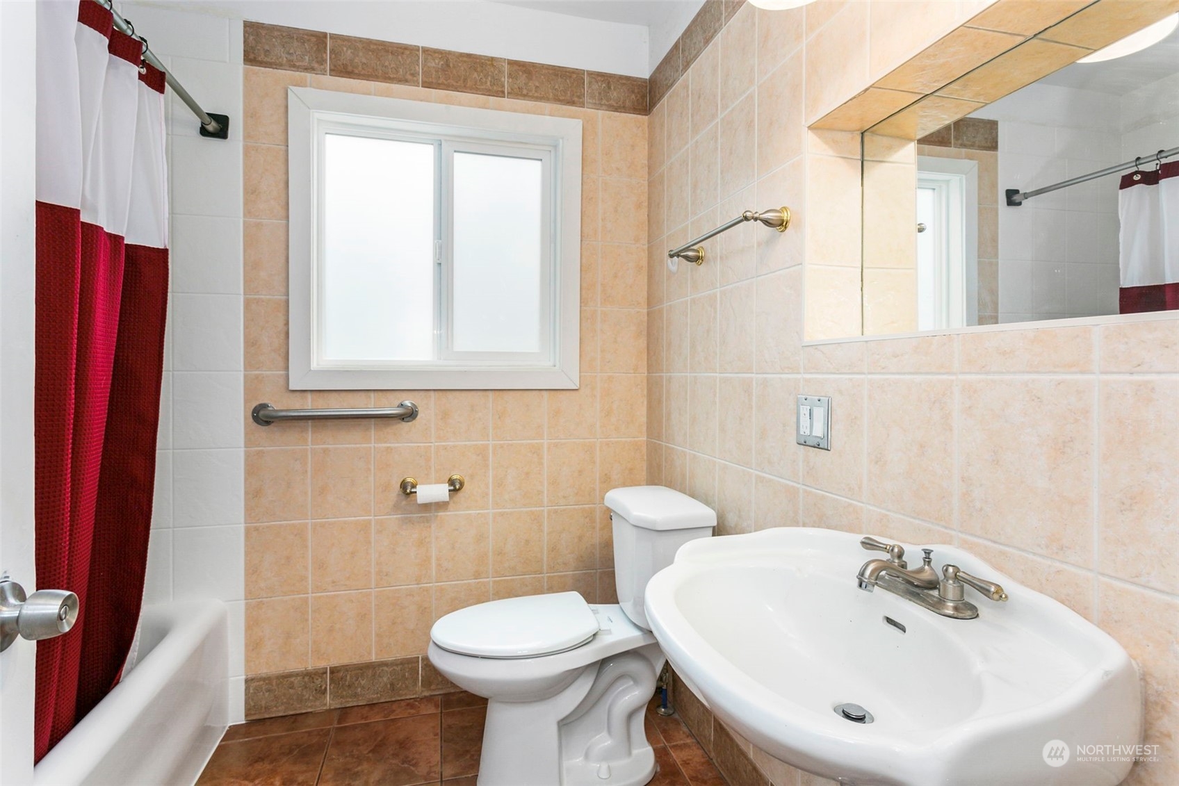 710 Prospect Avenue North Kent, WA 98031 - Photo 19 of 37 a bathroom with a sink a toilet and a mirror