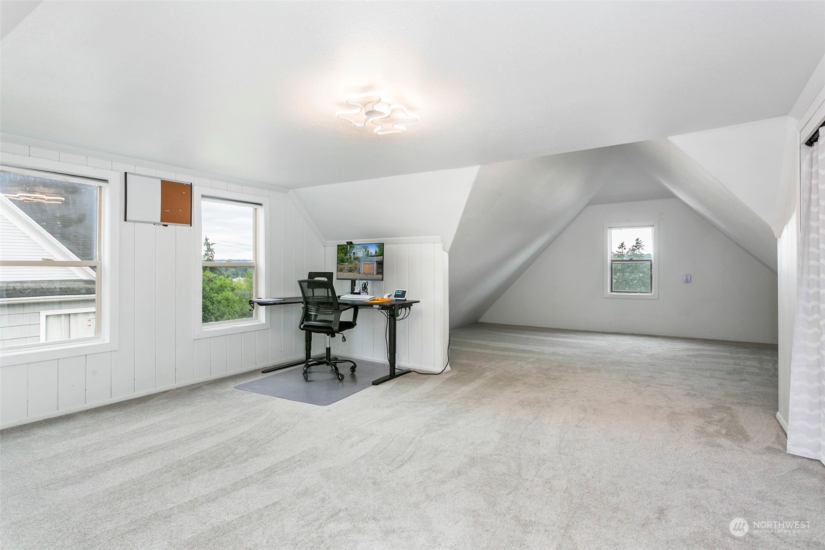 710 Prospect Avenue North Kent, WA 98031 - Photo 24 of 37 a view of a livingroom with a window and wooden floor