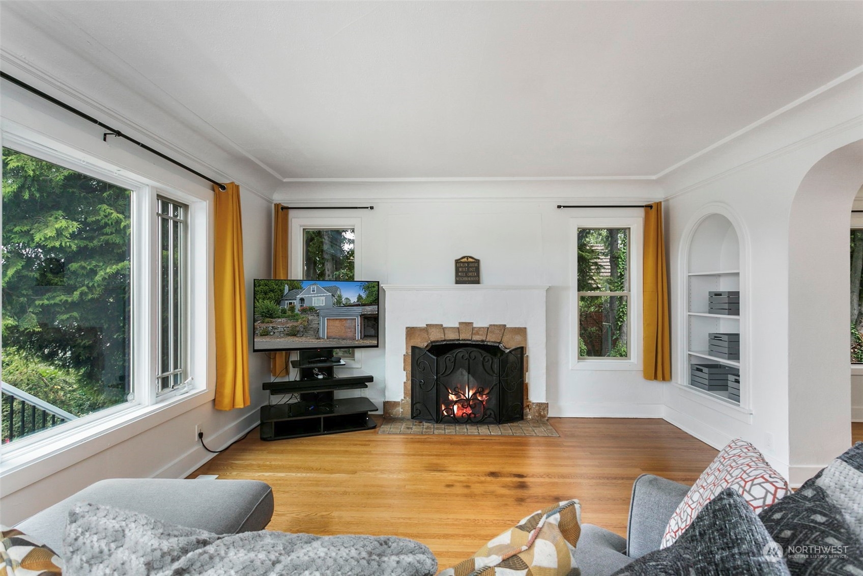 710 Prospect Avenue North Kent, WA 98031 - Photo 7 of 37 a living room with furniture large window and a fireplace