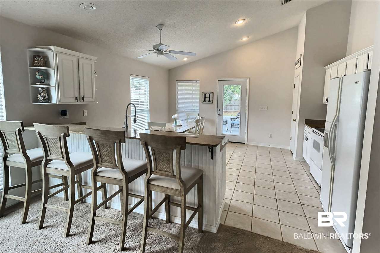 5113 Pine Way Orange Beach, AL 36561 - Photo 5 of 16 KITCHEN TO SCREEN PORCH
