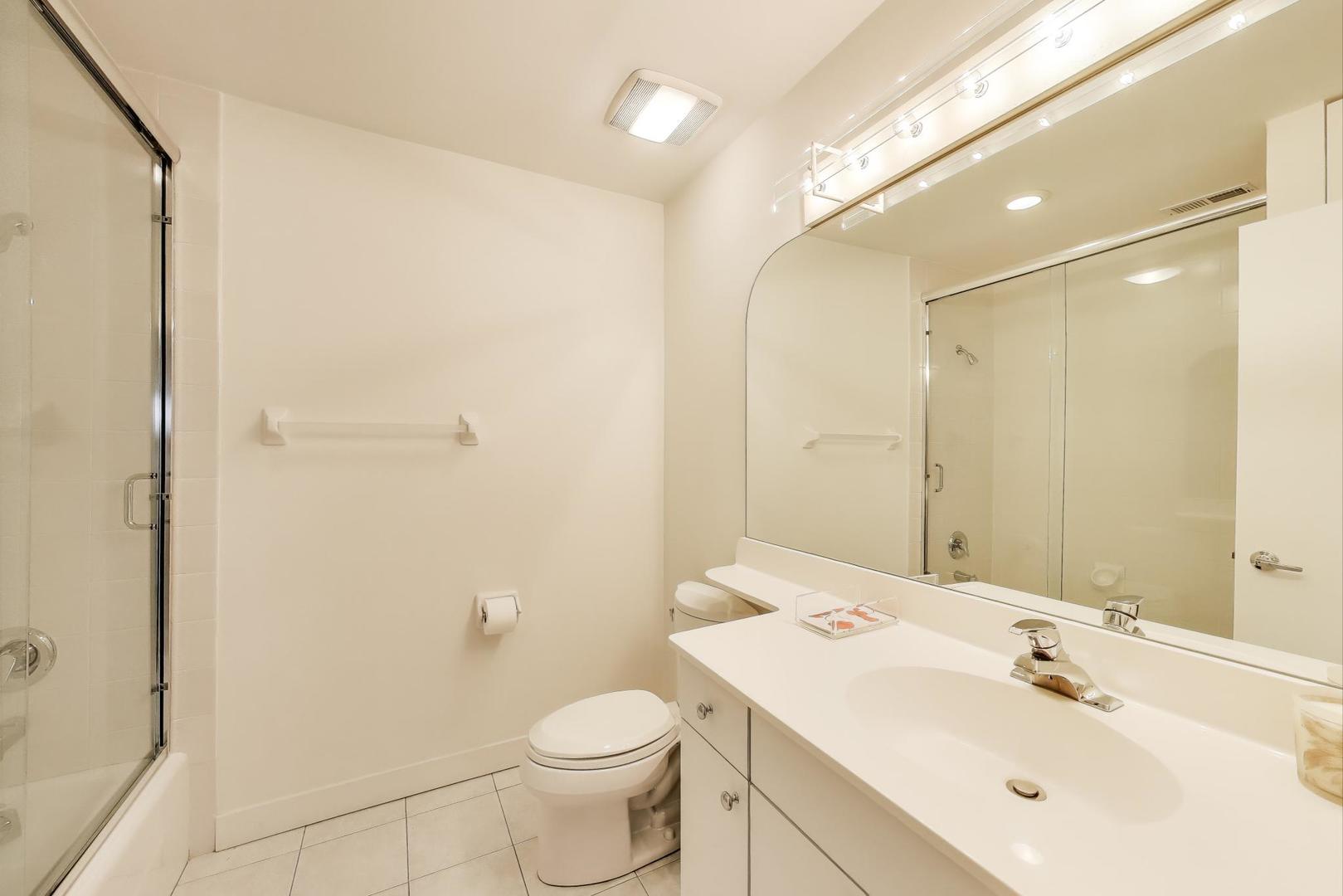 90 Riparian Road Highland Park, IL 60035 - Photo 26 of 76 a bathroom with a sink a toilet and shower