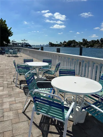a terrace of a house with outdoor seating