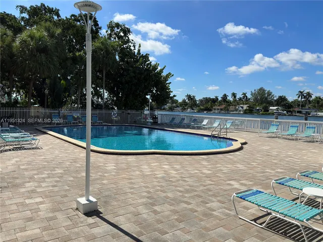 a view of a swimming pool with a patio