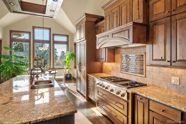 a dining room with furniture window and wooden floor