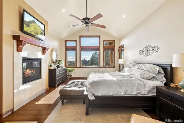 a spacious bedroom with a bed and a couch