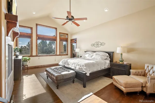 a living room with furniture a fireplace and a chandelier