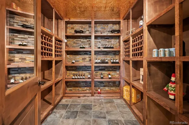 a living room with furniture a rug and a large window