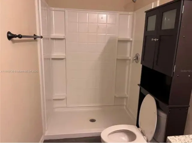 a bathroom with a sink and toilet