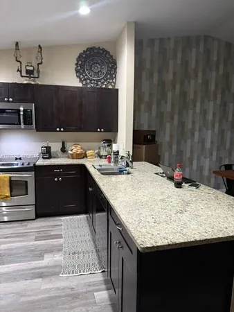 a kitchen with a sink and a cabinets