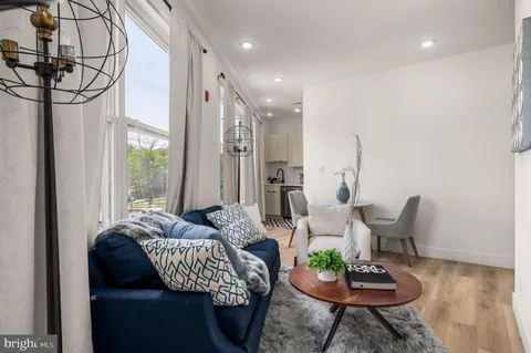 a living room with furniture and a large window