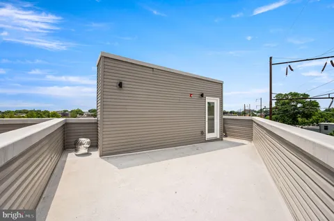 a view of balcony and yard