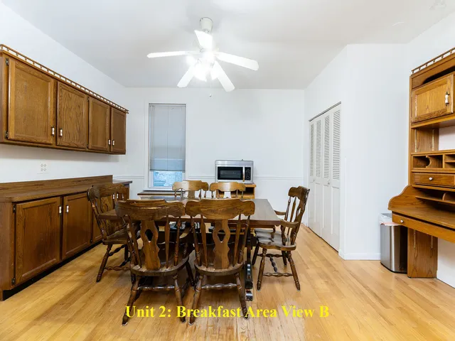 a kitchen with a refrigerator a stove top oven a sink and a window