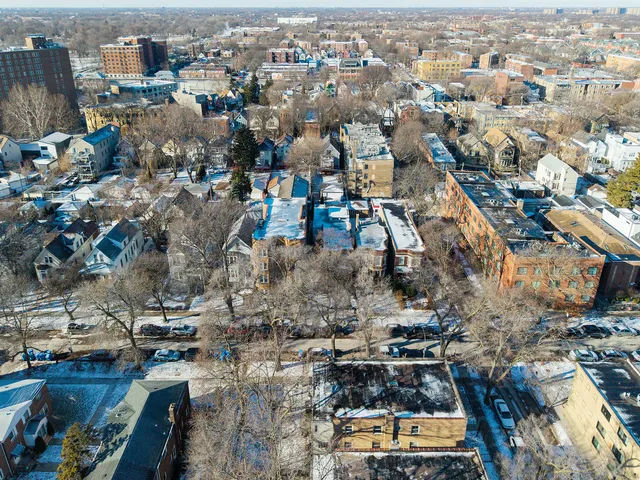an aerial view of a city with lots of residential buildings