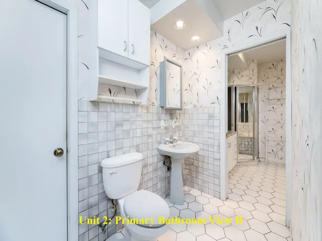 a view of a room with a ceiling fan