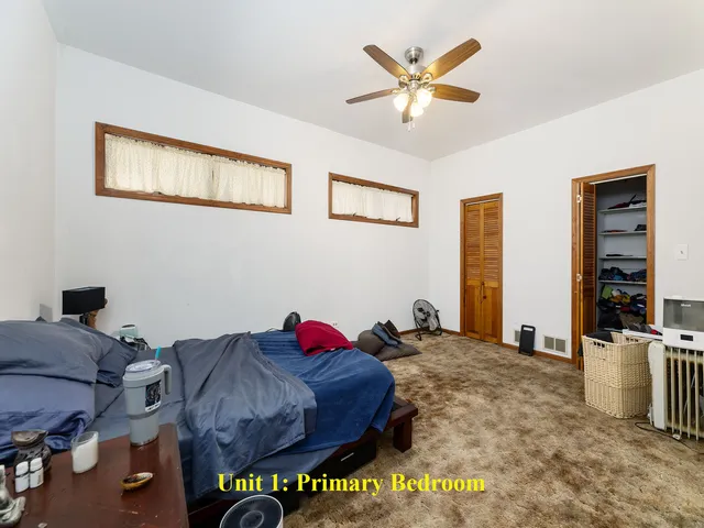 a kitchen with a white cabinets and appliances