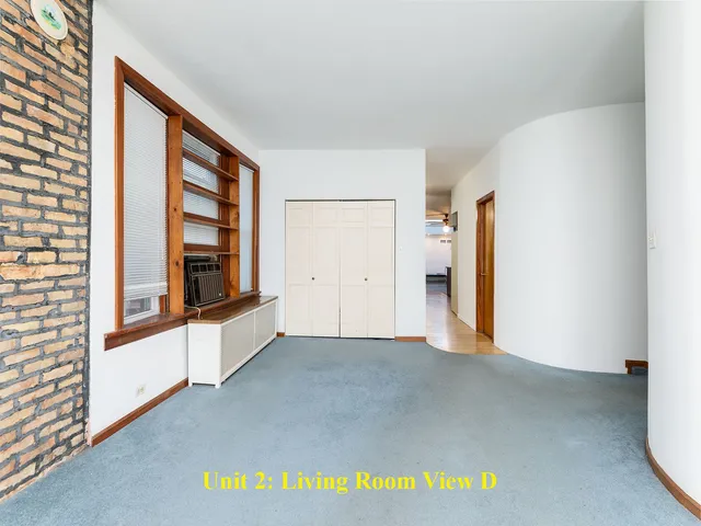 a view of a dining room with furniture and a chandelier