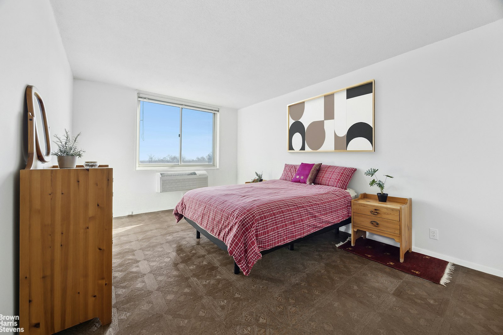 118-18 Union Turnpike, Unit 9B Queens, NY 11415 - Photo 4 of 9 a bedroom with a bed and a dresser