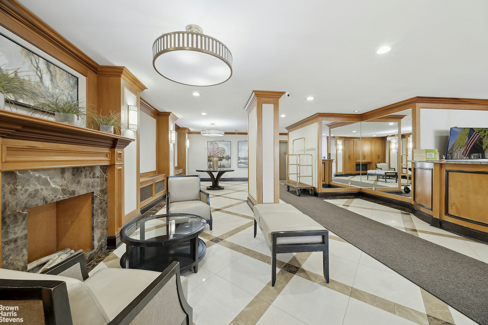 118-18 Union Turnpike, Unit 9B Queens, NY 11415 - Photo 8 of 9 a living room with furniture and a fireplace