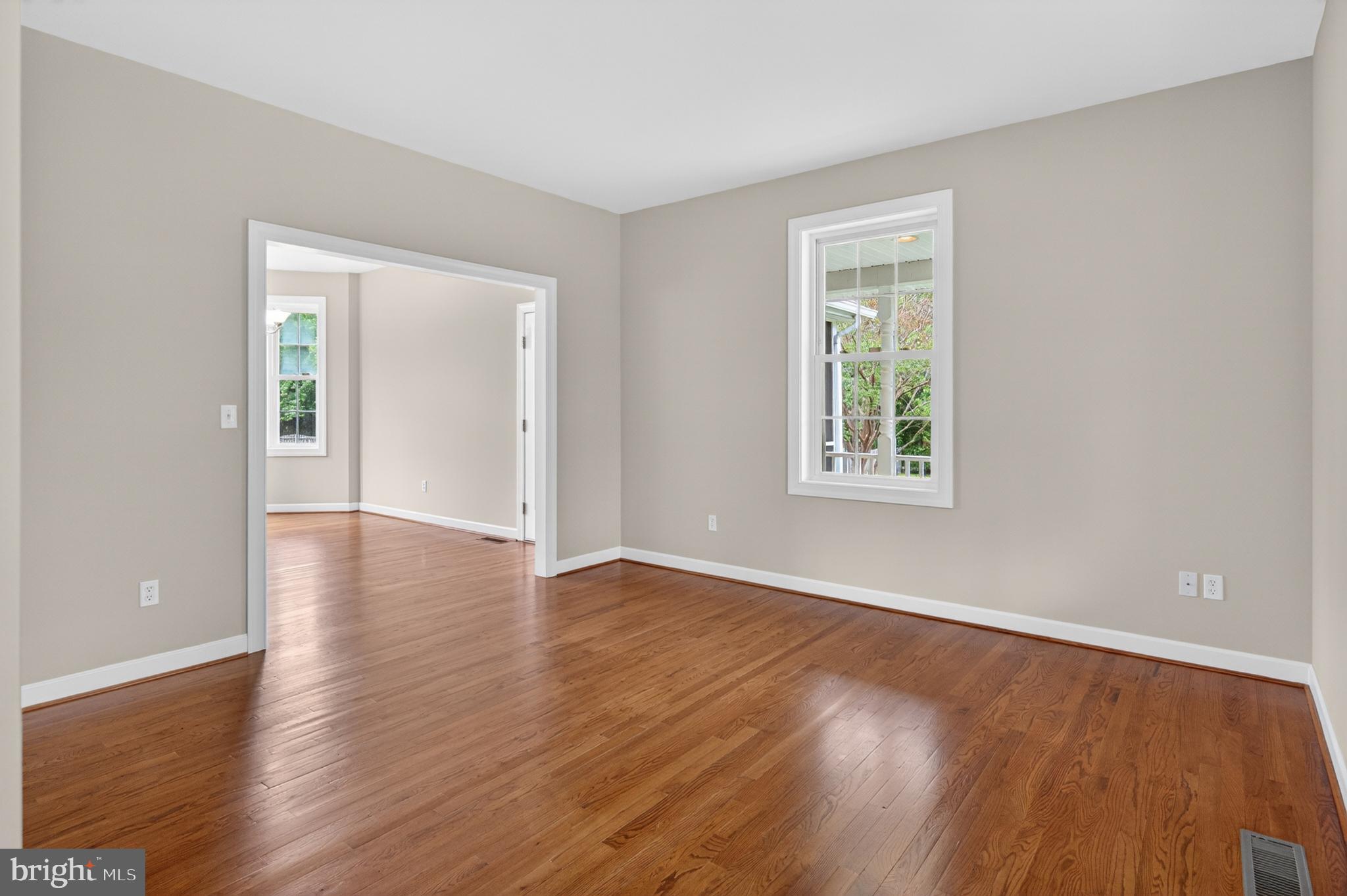 337 Roe Ingleside Road Centreville, MD 21617 - Photo 18 of 56 a view of an empty room with wooden floor and a window