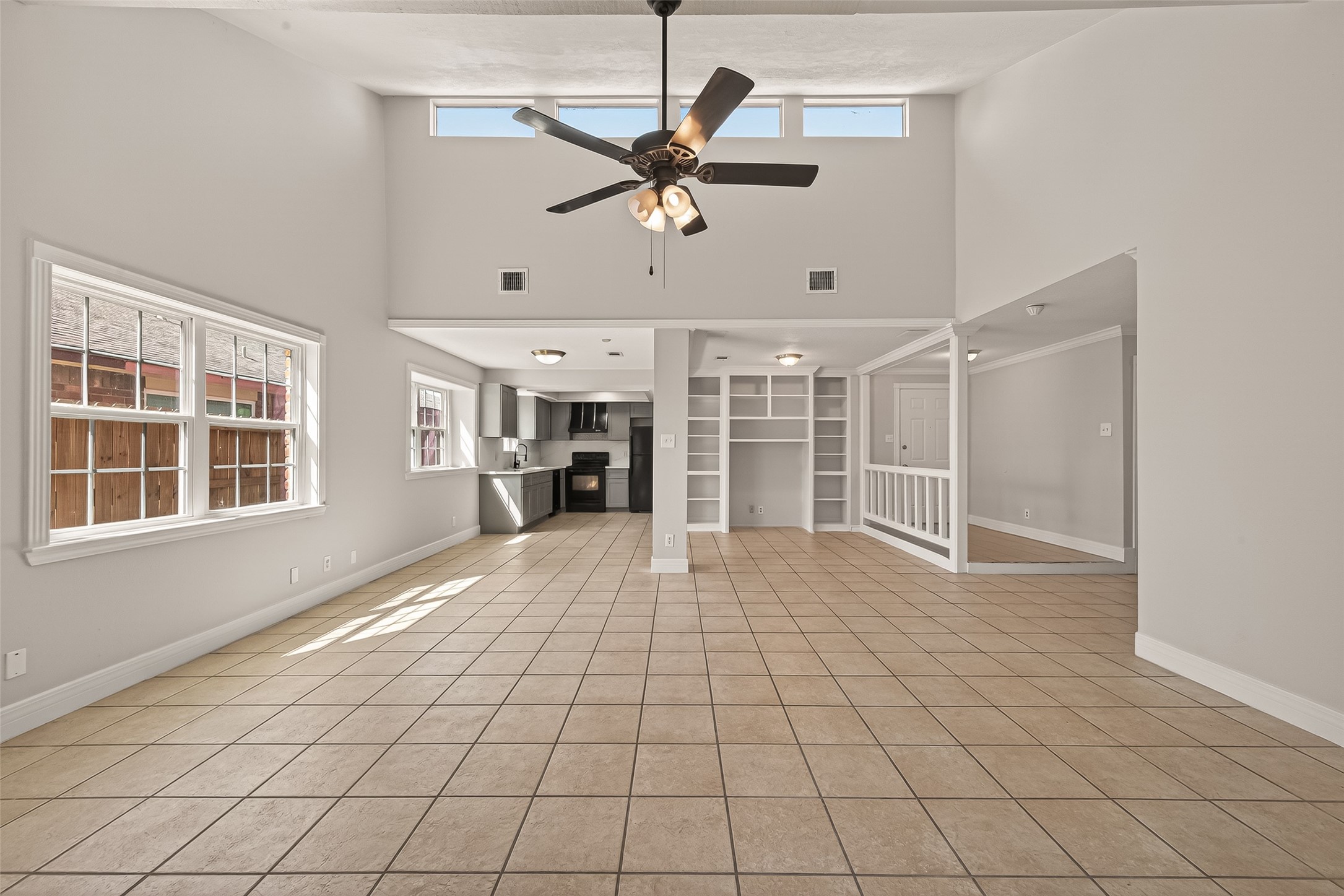 9503 Turtle Log Trail Houston, TX 77064 - Photo 11 of 41 a view of empty room with wooden floor and fan