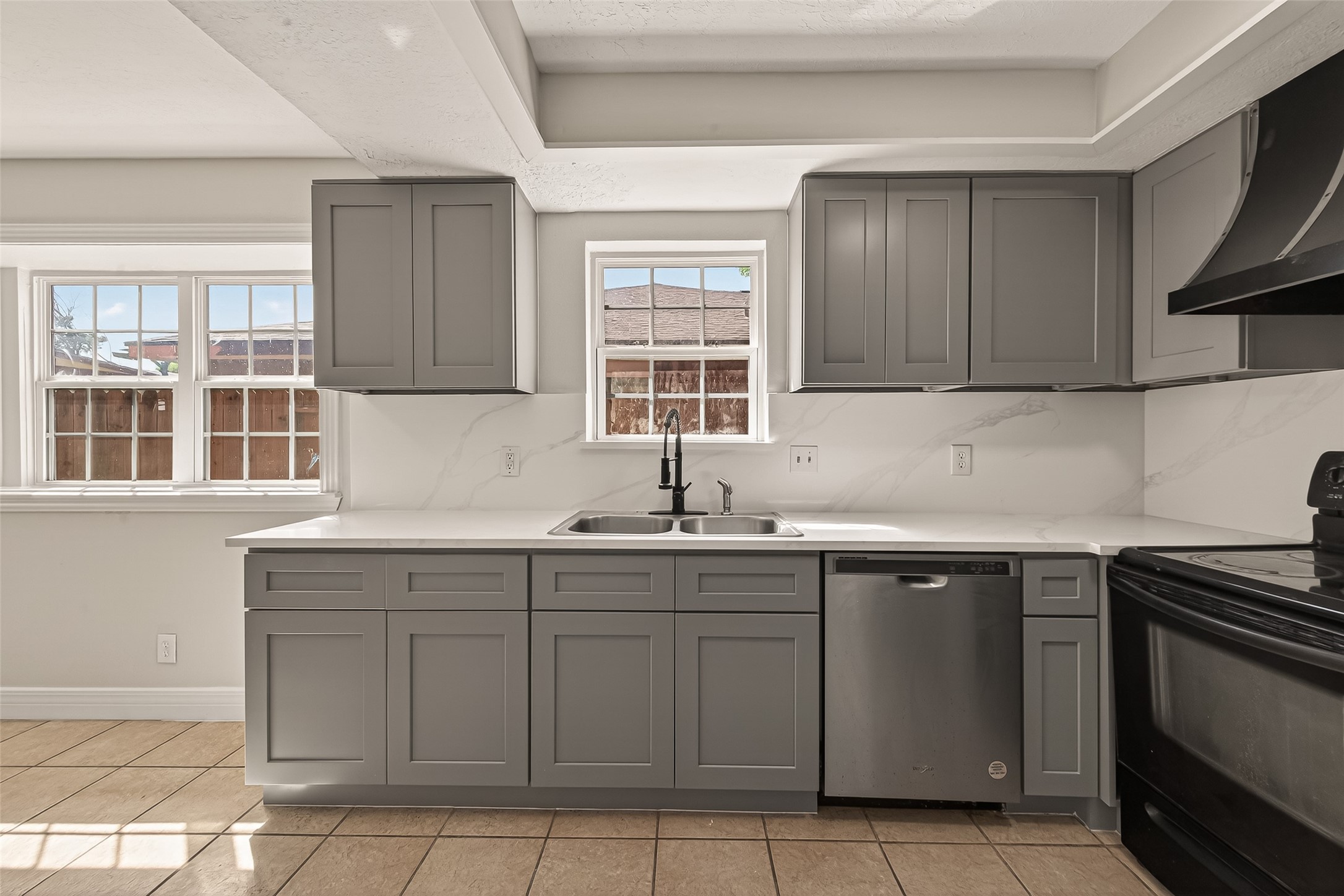 9503 Turtle Log Trail Houston, TX 77064 - Photo 16 of 41 a kitchen with a sink and cabinets