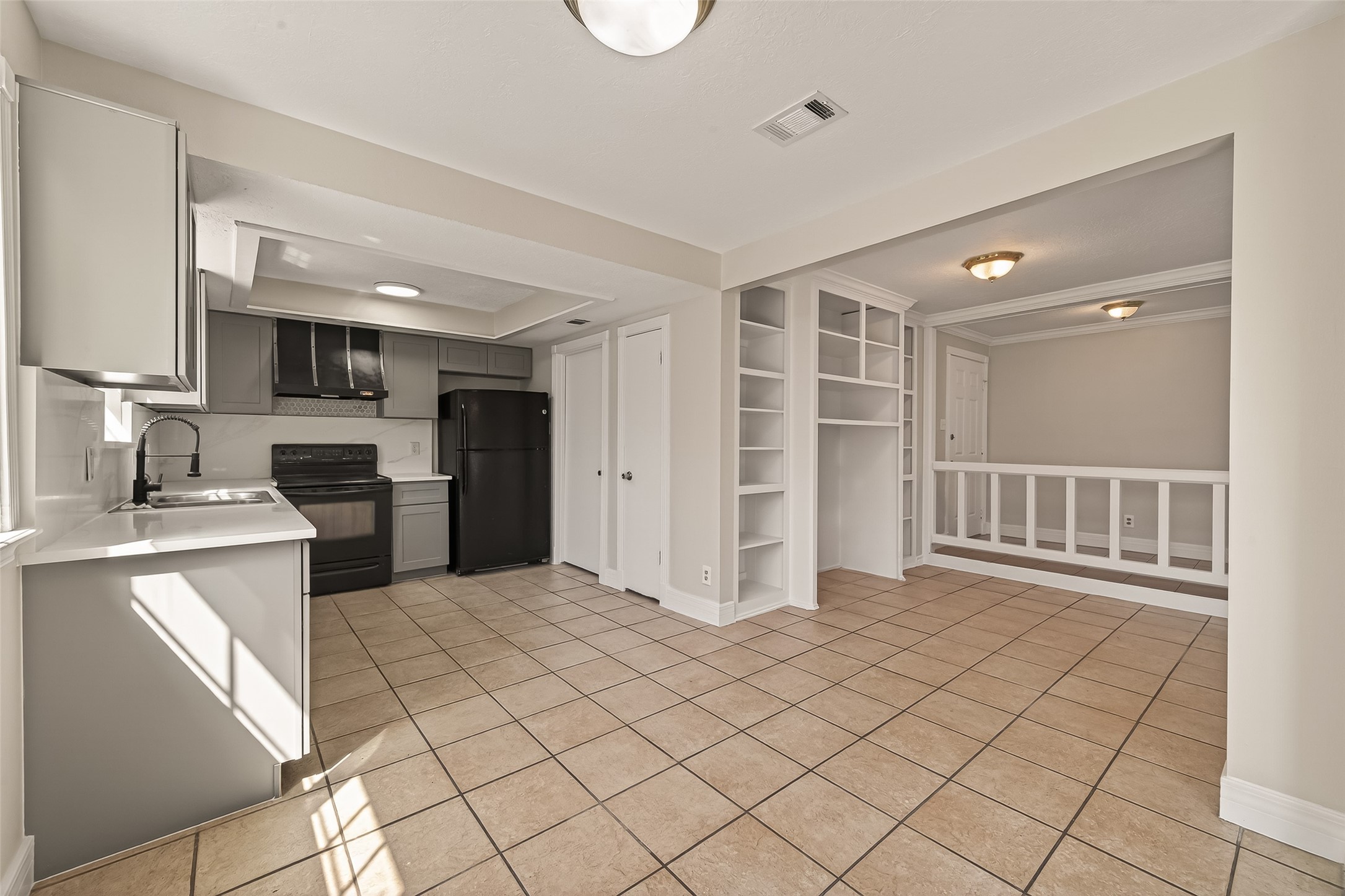 9503 Turtle Log Trail Houston, TX 77064 - Photo 18 of 41 a kitchen with granite countertop a sink cabinets and stainless steel appliances