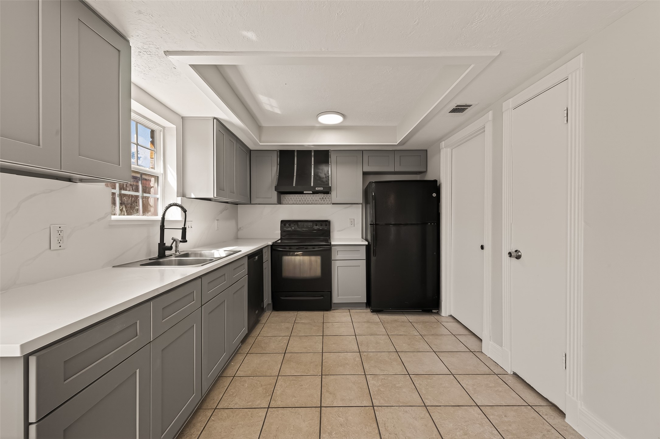 9503 Turtle Log Trail Houston, TX 77064 - Photo 20 of 41 a kitchen with stainless steel appliances granite countertop a refrigerator and a sink
