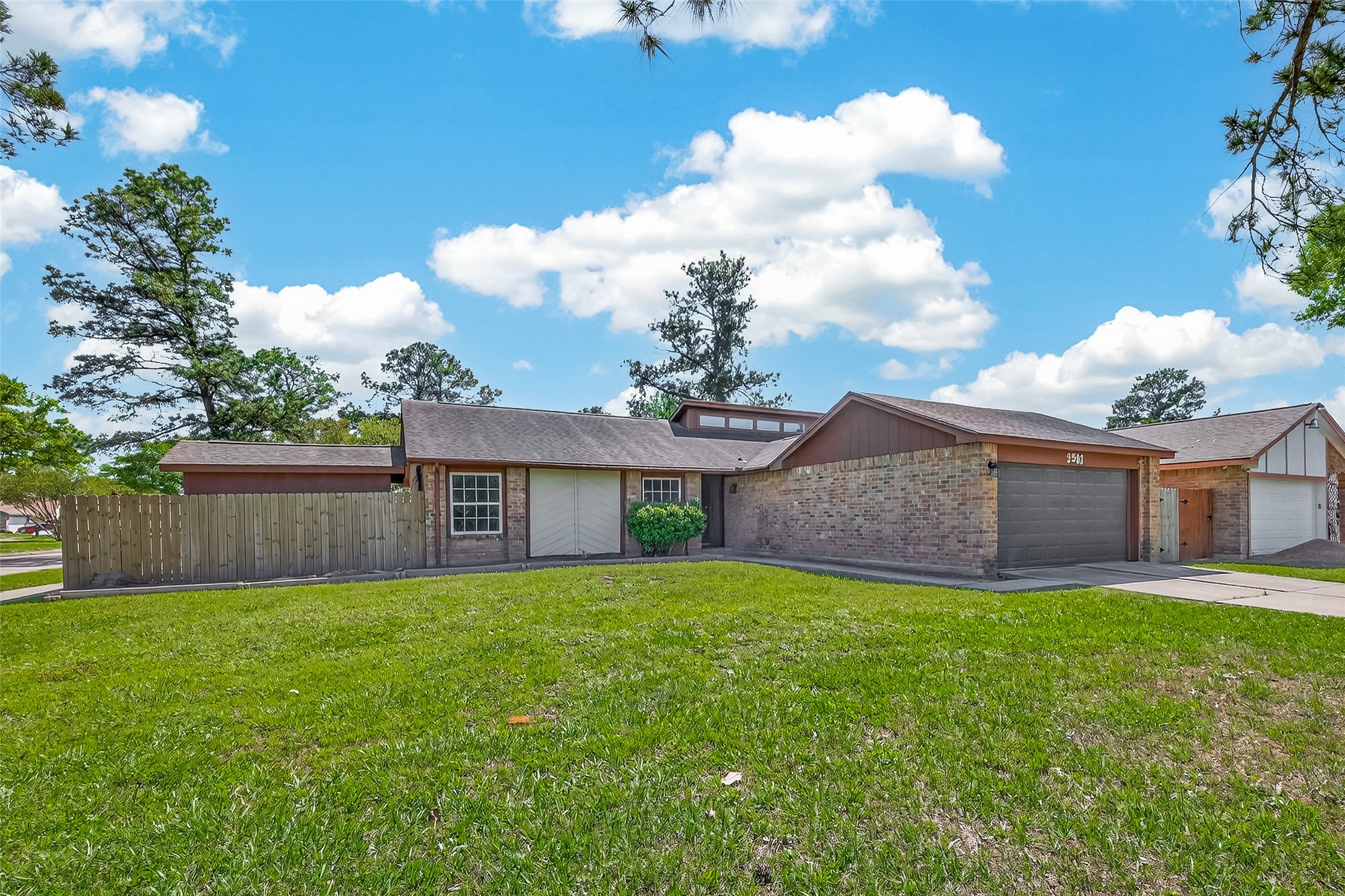 9503 Turtle Log Trail Houston, TX 77064 - Photo 2 of 41 a view of a house with a yard and large tree
