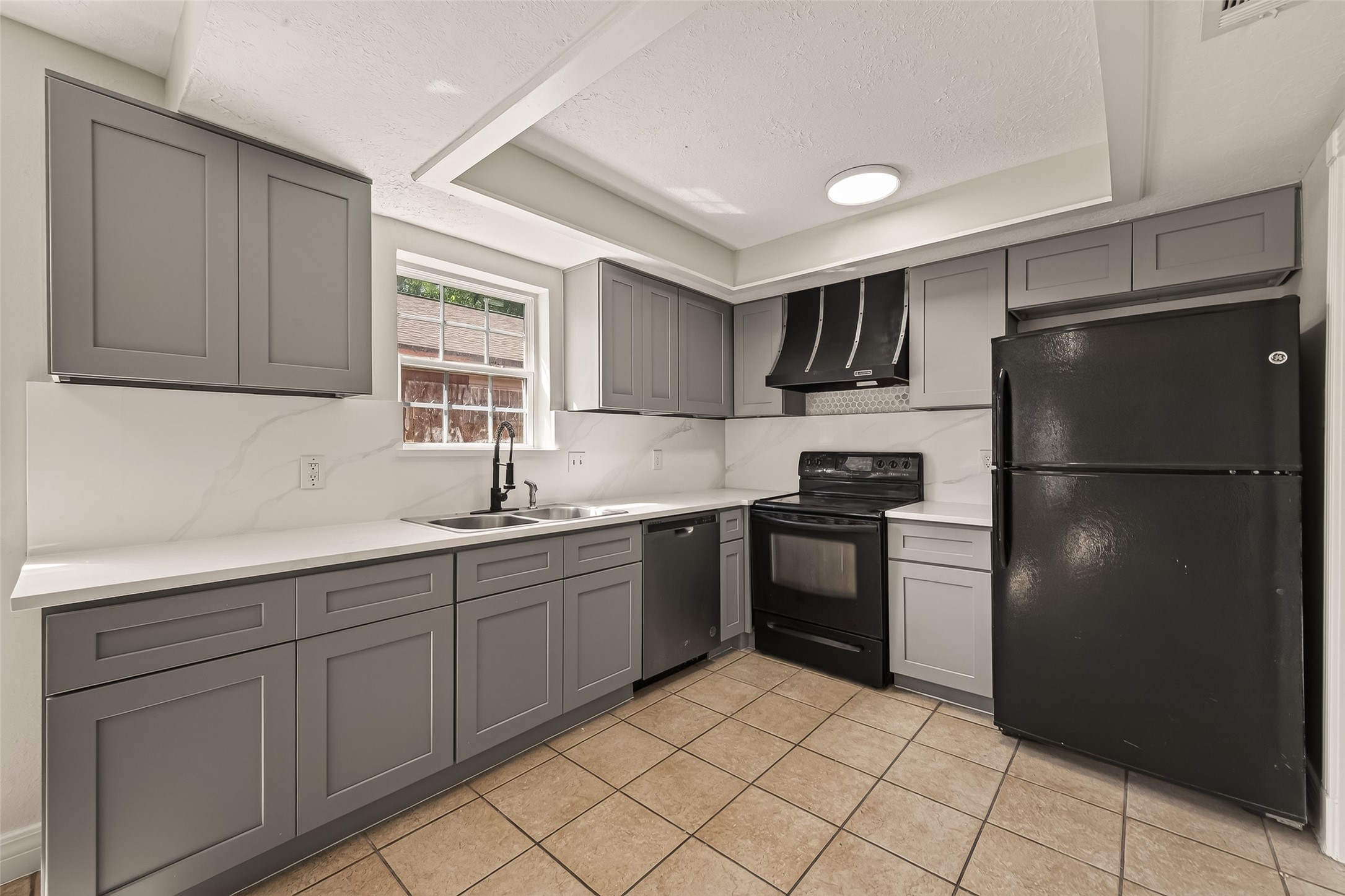 9503 Turtle Log Trail Houston, TX 77064 - Photo 21 of 41 a kitchen with a refrigerator sink and cabinets